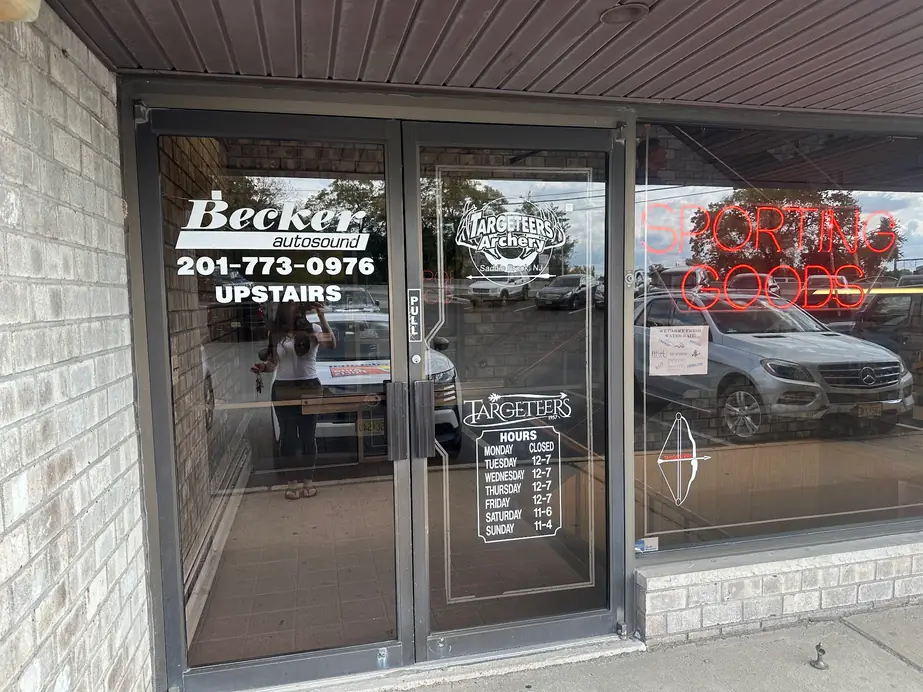 The Becker Auto Sound door at 101 Route 46 West with its UPSTAIRS sign and Hirschmann and Blaupunkt dealer decals